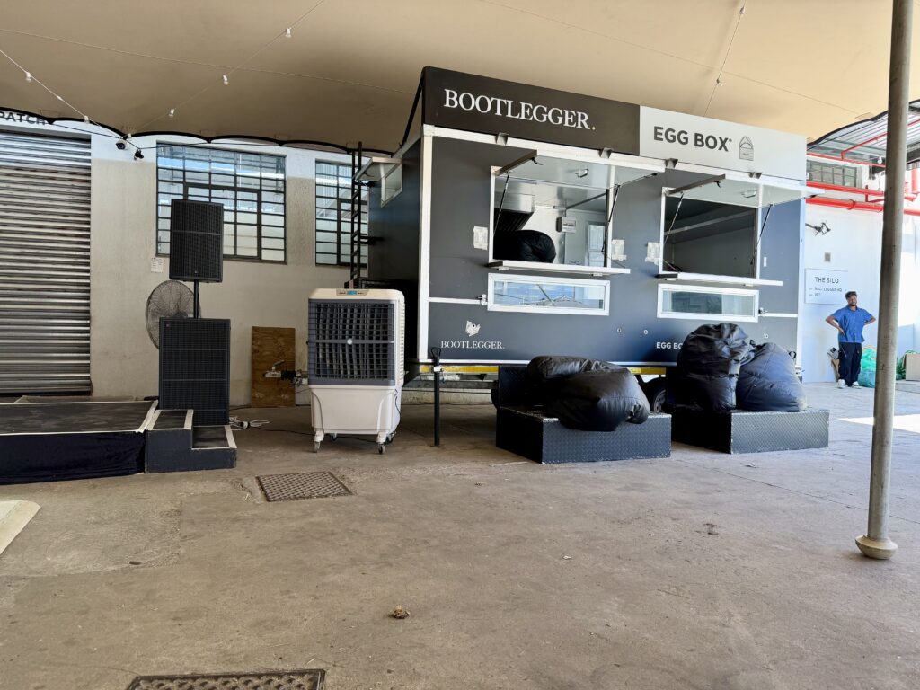 Large evaporative air coolers installed under stretch tent in Ndabeni