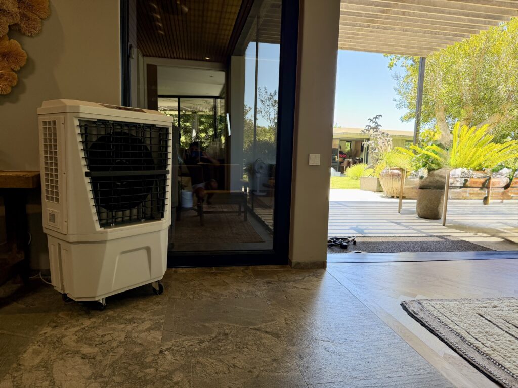 Medium-size evaporative air cooler used for indoor corporate conference cooling
