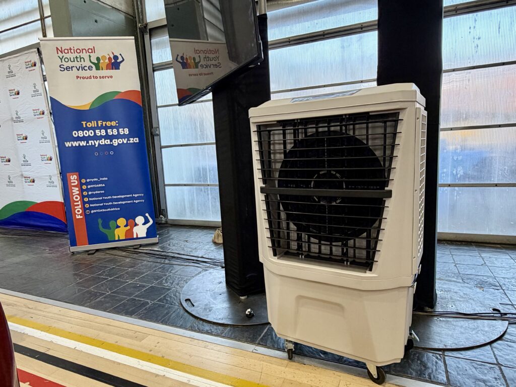 Evenly distributed evaporative air coolers inside large event hall